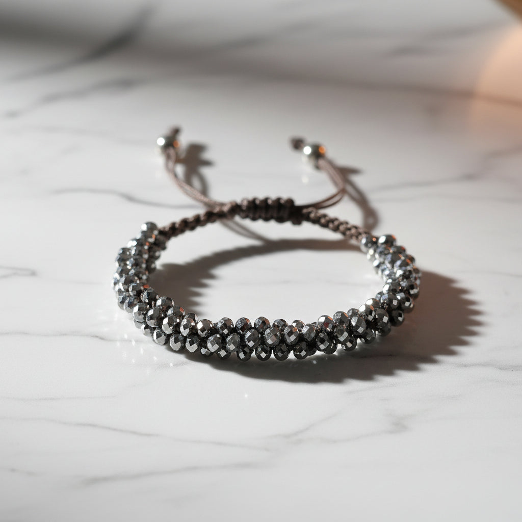 Bracelet tressé perles à facettes argentées