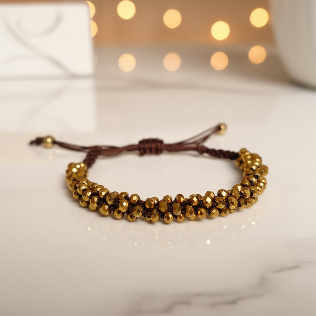 Bracelet tressé perles à facettes dorées
